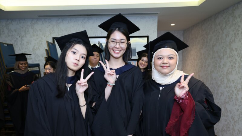 university student smile pose at camera