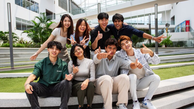 group of students happy smiling at camera mixed race
